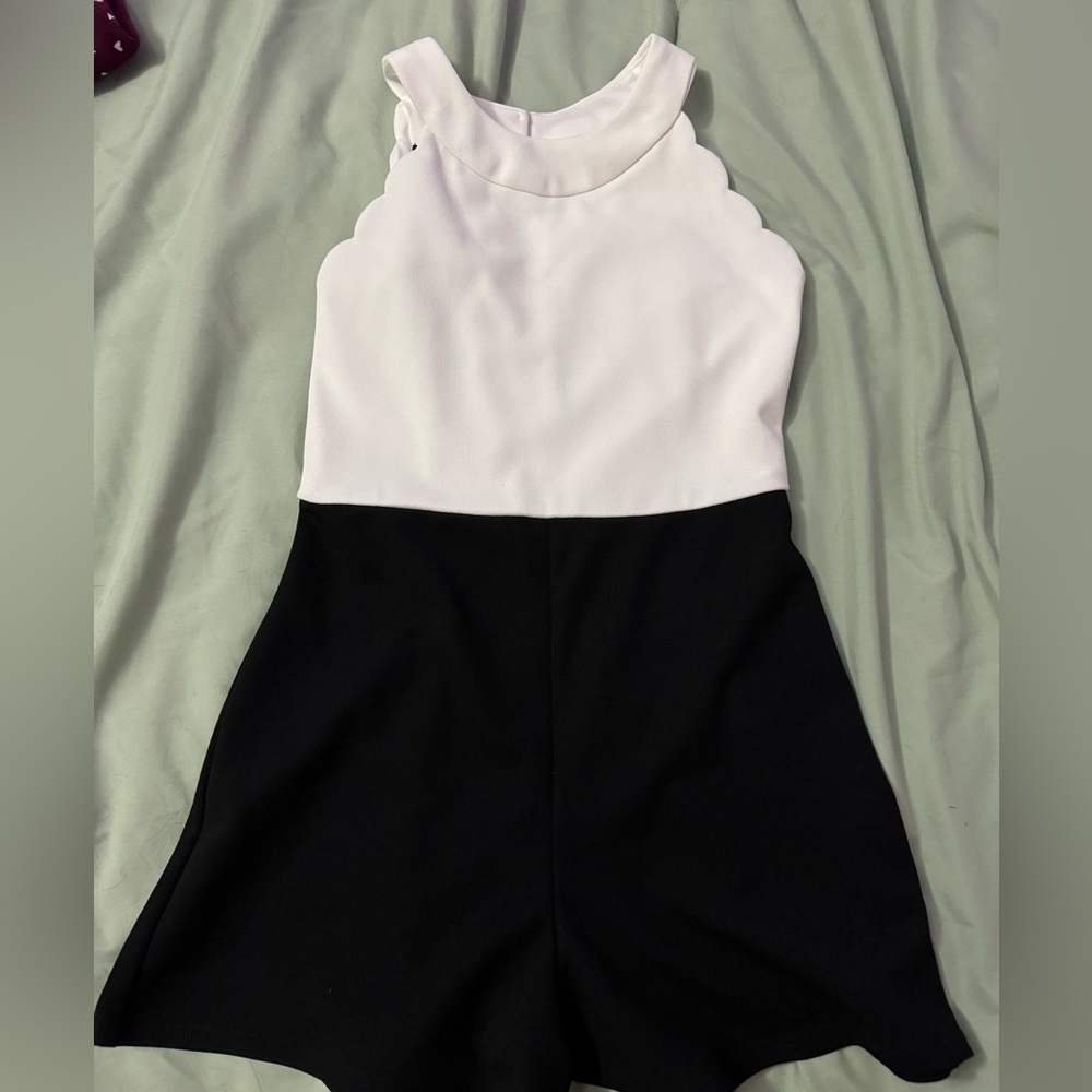 Size 8 romper for girls. Looks a lot like a shorter dress